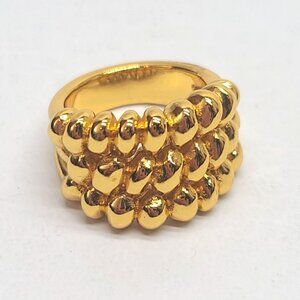 UNOde50 gold tone sculptural modern braid band ring Spanish designer statement